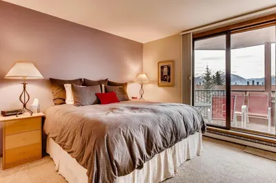 a bedroom with a bed and a large window at 233 Marina Place in Dillon