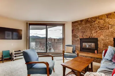 a living room with a stone wall at 233 Marina Place in Dillon