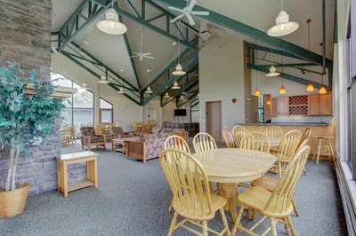 a dining room with a table and chairs at A203 Treehouse in Silverthorne