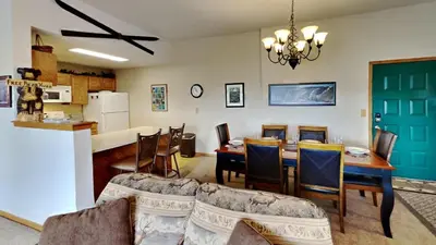 a kitchen and dining room with a table and chairs at CC102 Buffalo Village in Silverthorne