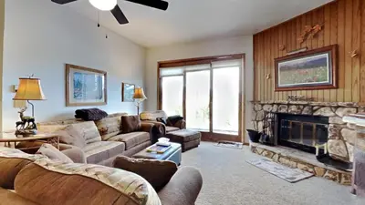 a living room with a couch and a fireplace at CC102 Buffalo Village in Silverthorne