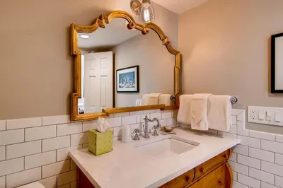 a bathroom with a sink and a mirror at Ten Mile Island C220 in Frisco