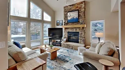 a living room with two couches and a fireplace at 33 Corinthian Circle in Dillon