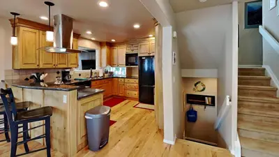 a kitchen with wooden cabinets and stainless steel appliances at 33 Corinthian Circle in Dillon