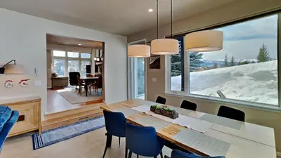 a dining room with a table and a large window at 33 Corinthian Circle in Dillon
