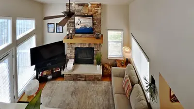 a living room with a couch and a fireplace at 33 Corinthian Circle in Dillon
