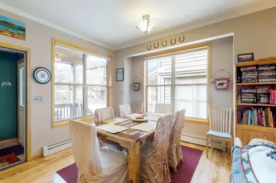 a dining room with a table and chairs at Miners Run 79 in Silverthorne