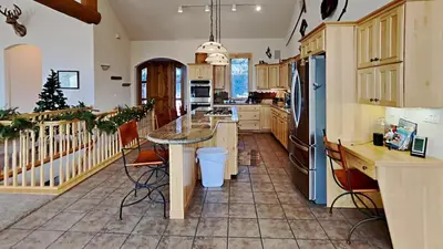 a kitchen with a table and a refrigerator at 36 James Court in Dillon