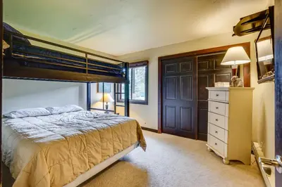 a bedroom with a bunk bed and a dresser at Dillon Vacation Rental 1 Mi to Keystone Resort in Dillon