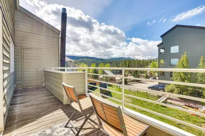 a balcony with chairs and a view of the mountains at Winter Park Condo Rental 4 Mi to Ski Resort! in Winter Park