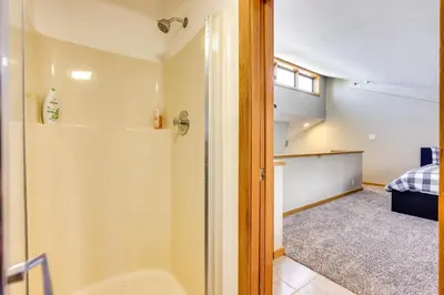 a bathroom with a shower and a bedroom at Winter Park Condo Rental 4 Mi to Ski Resort! in Winter Park
