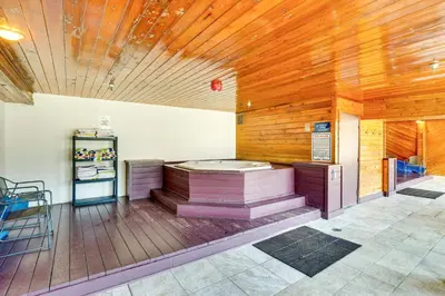 a room with a jacuzzi in the middle of a building at Winter Park Condo Rental 4 Mi to Ski Resort! in Winter Park