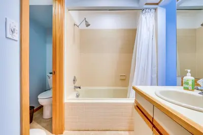 a bathroom with a tub and a toilet and a sink at Winter Park Condo Rental 4 Mi to Ski Resort! in Winter Park