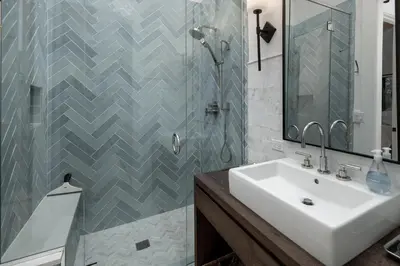 a bathroom with a sink and a shower at Ski Shores- The Chalet cabin in Grand Lake