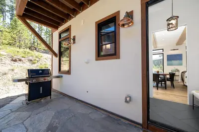 a home with a patio and a dining room at Ski Shores- The Chalet cabin in Grand Lake