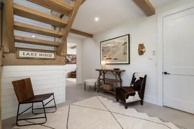 a hallway with chairs and a table in a house at Ski Shores- The Chalet cabin in Grand Lake