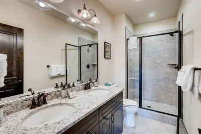 a bathroom with two sinks and a shower at Alders 4 Bedroom Townhome In East Keystone in Keystone