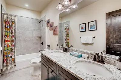 a bathroom with two sinks and a shower and a toilet at Alders 4 Bedroom Townhome In East Keystone in Keystone