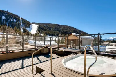 a hot tub on the deck of a ski resort at Keystone Slopeside Studio Condo in Keystone