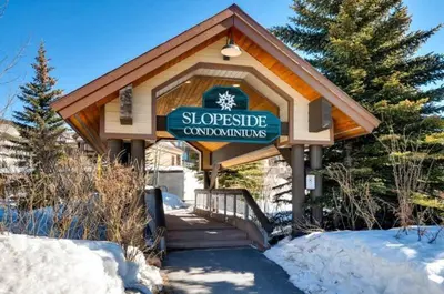 a building with a sign for a ski resort at Keystone Slopeside Studio Condo in Keystone
