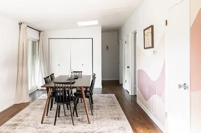 a dining room with a table and chairs at Chic Mid-Century Home Near Olde Town Arvada in Arvada