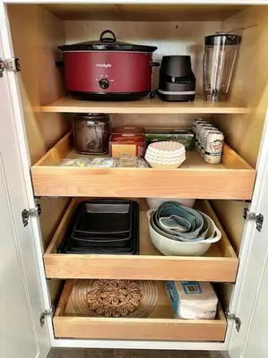 a cupboard filled with wooden shelves with food at NEW: Tulum Oasis in Denver w/ Hot Tub & Games in Denver