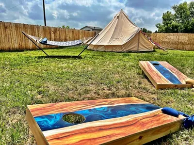 a tent and a hammock in a yard at NEW: Tulum Oasis in Denver w/ Hot Tub & Games in Denver