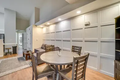 a dining room with a table and chairs at 16 Mi to DIA Townhome with Fireplace in Aurora in Aurora