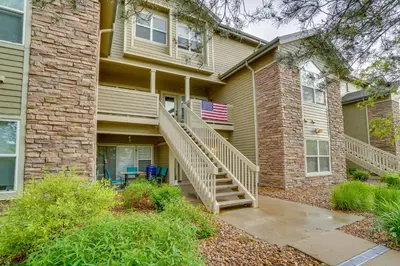 a house with a staircase in front of it at 16 Mi to DIA Townhome with Fireplace in Aurora in Aurora