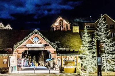 a building with a christmas tree in front of it at 8045 Black Bear condo in Keystone