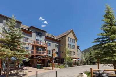 a resort building with tables and chairs in the street at 8045 Black Bear condo in Keystone