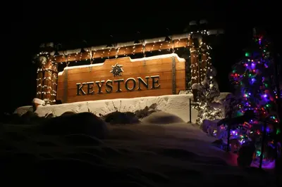 a christmas tree and a sign that says kynes at Quicksilver 1677 by SummitCove Lodging in Keystone