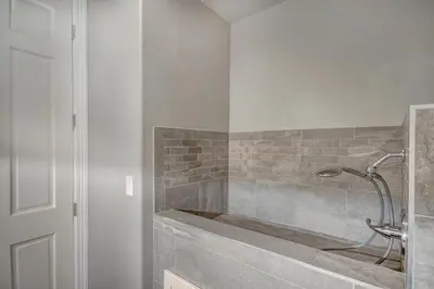 a bathroom with a shower with a tub at 5 Ski Resorts within 16 Miles - Salt Water Hot Tub in Dillon