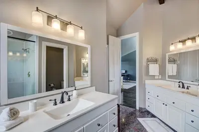 a bathroom with two sinks and a large mirror at 5 Ski Resorts within 16 Miles - Salt Water Hot Tub in Dillon