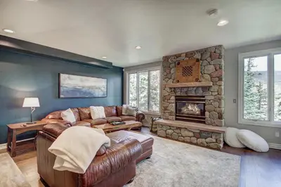 a living room with a couch and a fireplace at 5 Ski Resorts within 16 Miles - Salt Water Hot Tub in Dillon