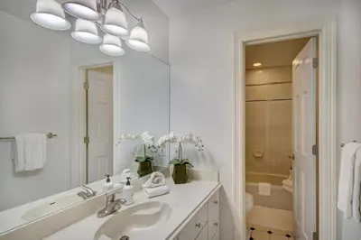 a white bathroom with a sink and a mirror at 5 Ski Resorts within 16 Miles - Salt Water Hot Tub in Dillon