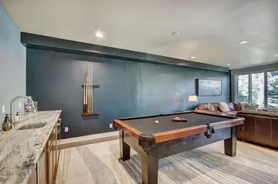 a living room with a pool table in it at 5 Ski Resorts within 16 Miles - Salt Water Hot Tub in Dillon