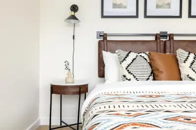 a bedroom with a bed and a lamp at Keystone Lake - MTN View - Pool Hot Tub Gym Sauna in Dillon