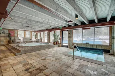 a large room with a swimming pool in a building at Keystone Lake - MTN View - Pool Hot Tub Gym Sauna in Dillon