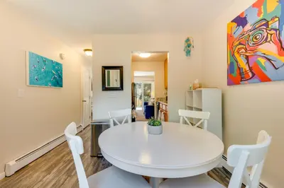 a white dining room with a white table and chairs at Beautiful Boulder Townhome Walk to CU and Pearl St! in Boulder