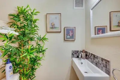 a bathroom with a sink and a plant at Beautiful Boulder Townhome Walk to CU and Pearl St! in Boulder