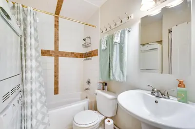 a bathroom with a sink and a toilet and a tub at Beautiful Boulder Townhome Walk to CU and Pearl St! in Boulder