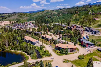 an aerial view of a resort with a lake at Mountain Vista Retreat in Winter Park