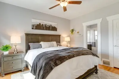 a bedroom with a large bed and a ceiling fan at Updated Denver Home about 3 Mi to Downtown! in Denver