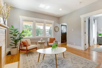 a living room with a table and chairs at Updated Denver Home about 3 Mi to Downtown! in Denver