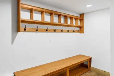 a room with a wooden bench on the wall at Waterdance House home in Frisco