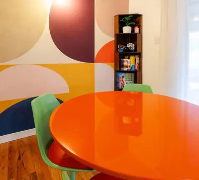 an orange table and two green chairs in a room at PingPong-YardGames-NewKitchen in Arvada