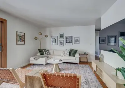 a living room with a couch and a table at Denver Hot Tub Retreat Near Downtown - 20 Percent Off Feb in Westminster
