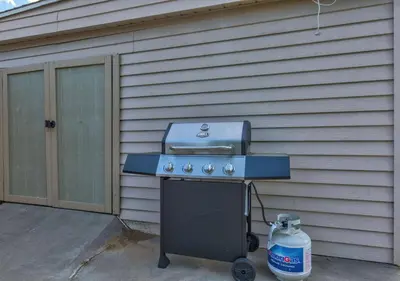 a gas grill sitting outside of a house at Denver Hot Tub Retreat Near Downtown - 20 Percent Off Feb in Westminster