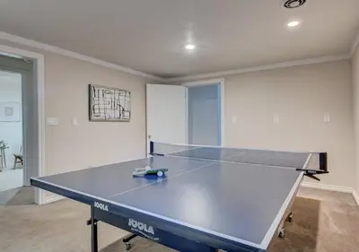a ping pong table in the middle of a room at Denver Hot Tub Retreat Near Downtown - 20 Percent Off Feb in Westminster